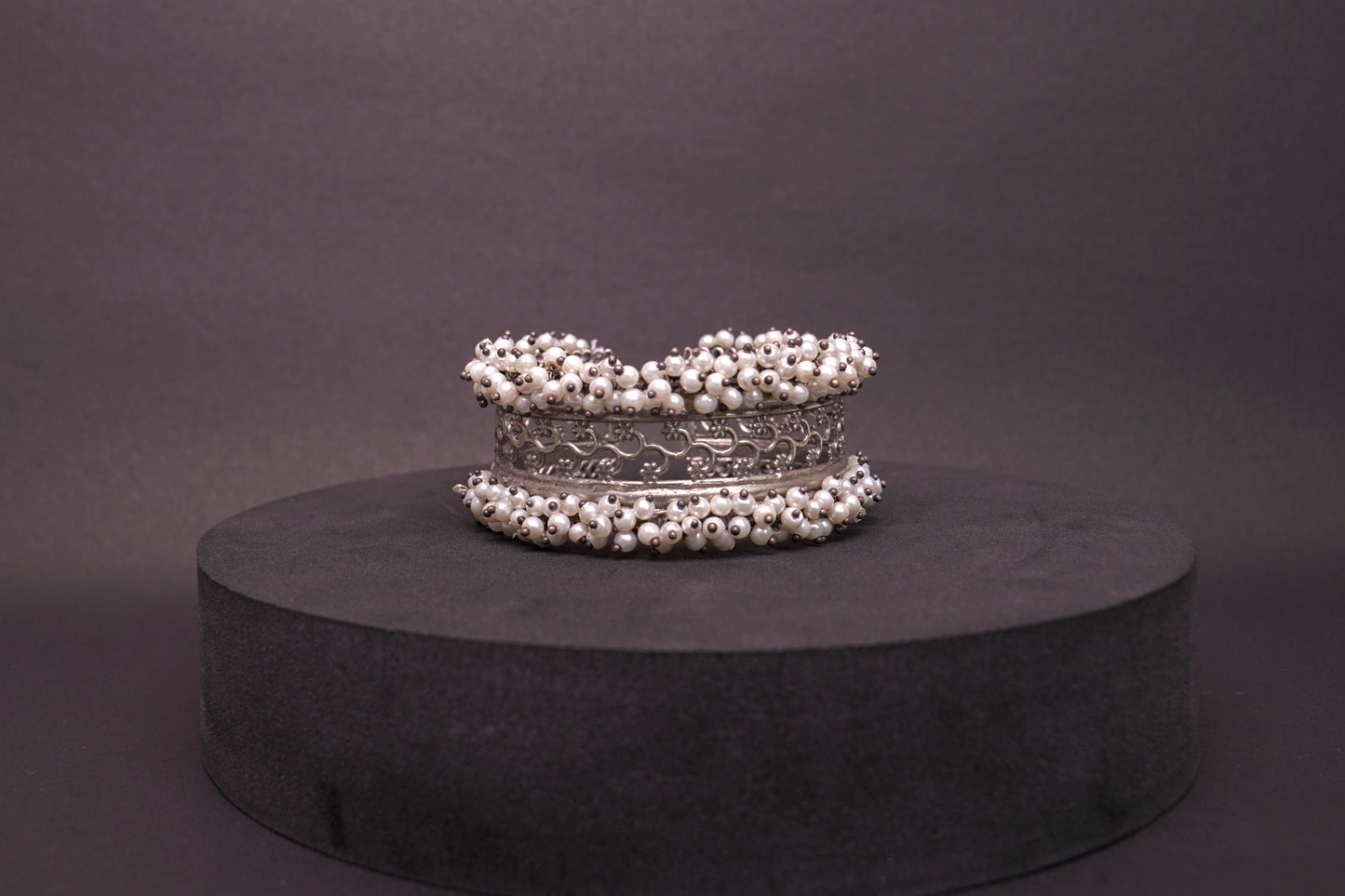 Open, adjustable flower pattern bracelet with dainty pearls