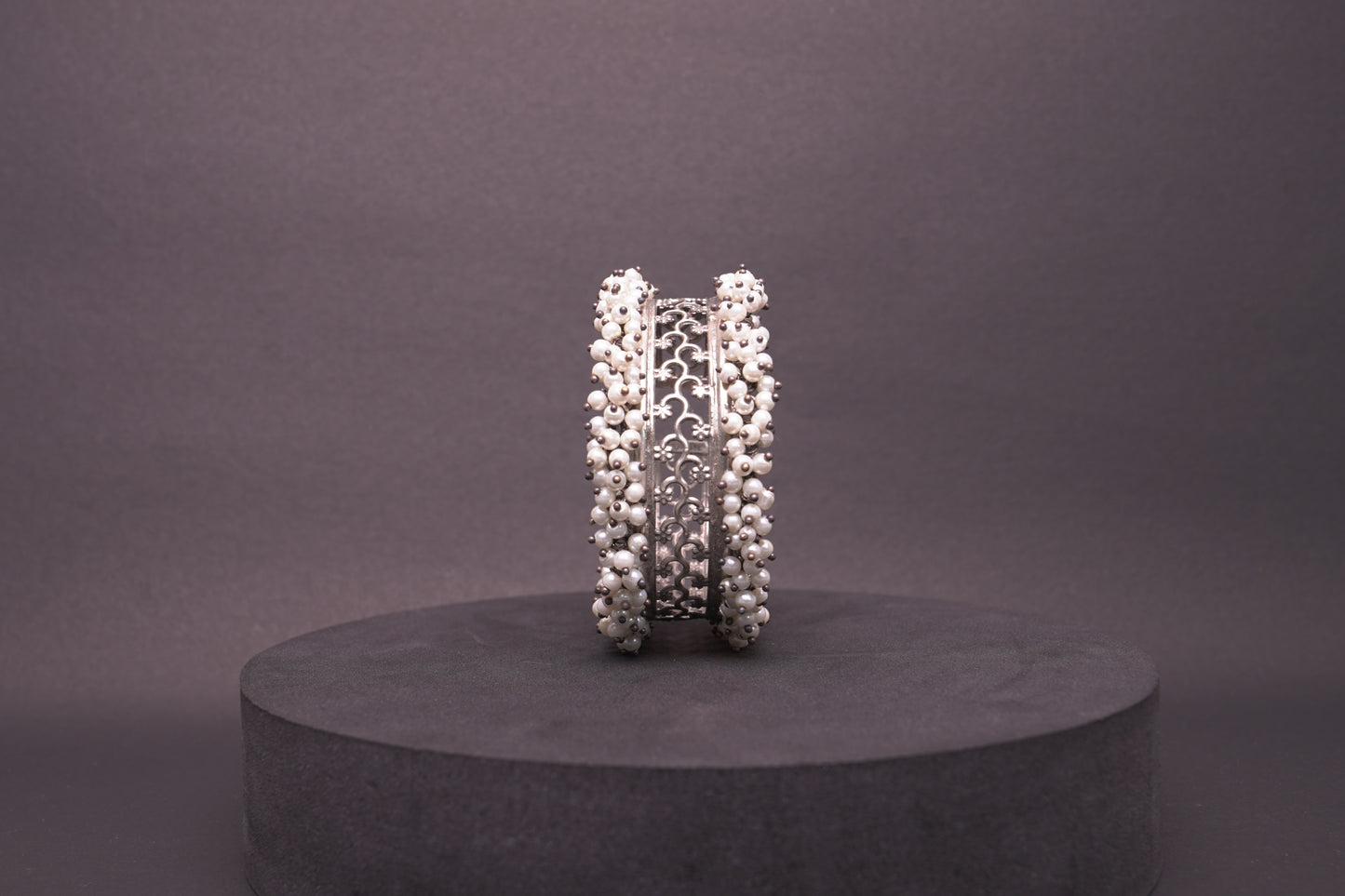 Open, adjustable flower pattern bracelet with dainty pearls