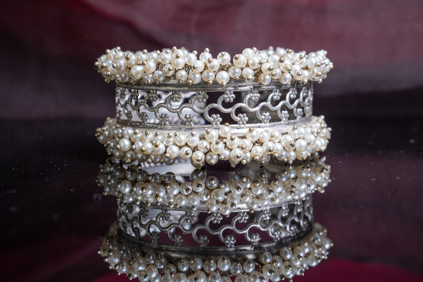 Open, adjustable flower pattern bracelet with dainty pearls