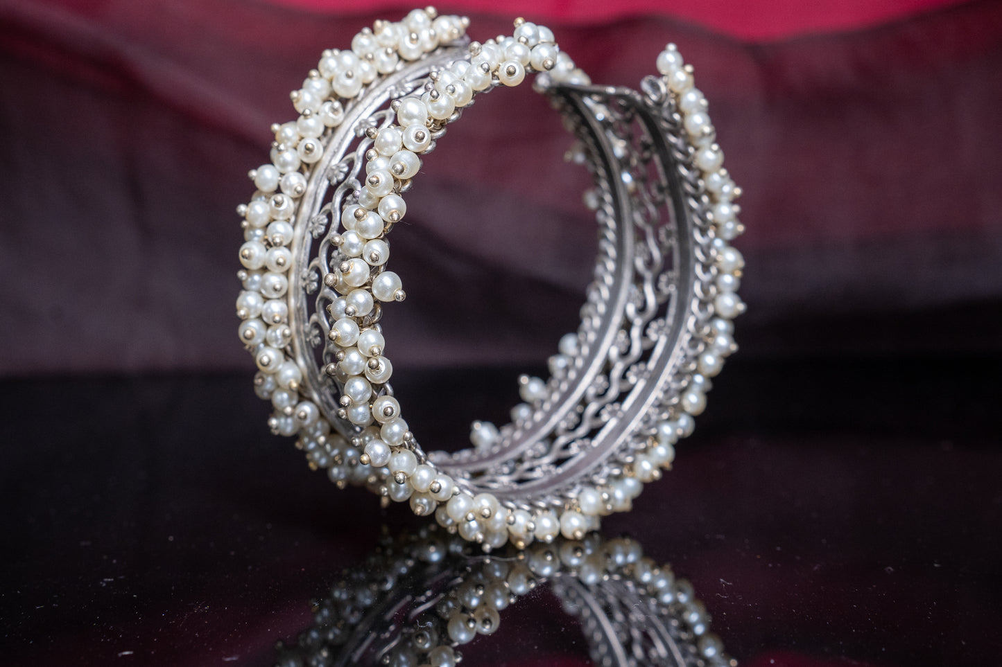 Open, adjustable flower pattern bracelet with dainty pearls