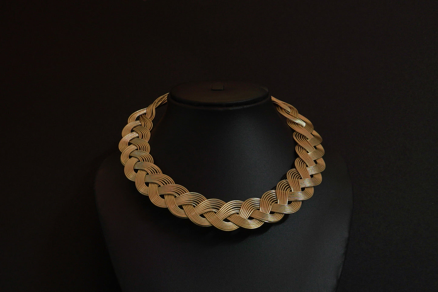 Statement gold finish hasli in an intricate knot pattern