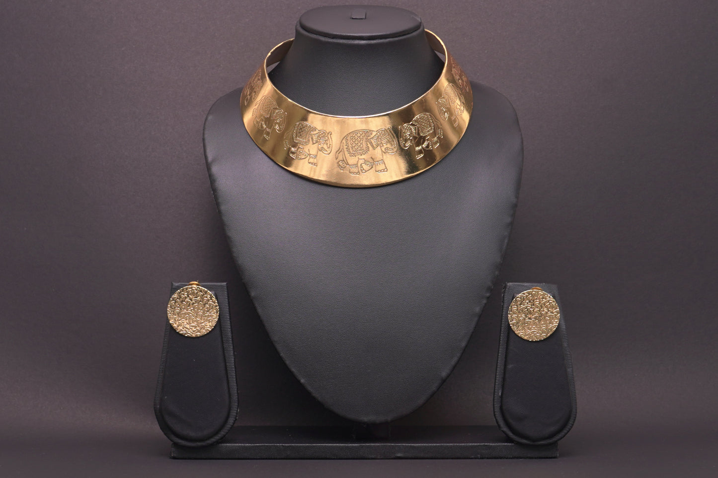 Statement gold finish hasli with elephant motifs and ear studs