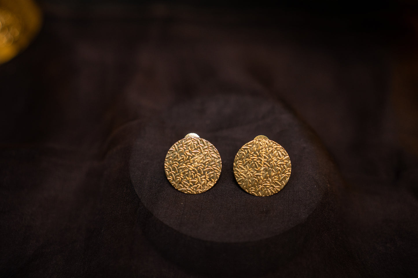 Statement gold finish hasli with elephant motifs and ear studs