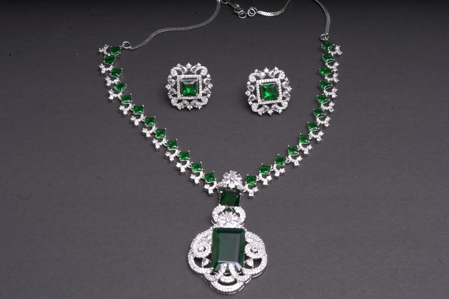 Statement necklace set in real American diamonds with a square cut emerald pendant