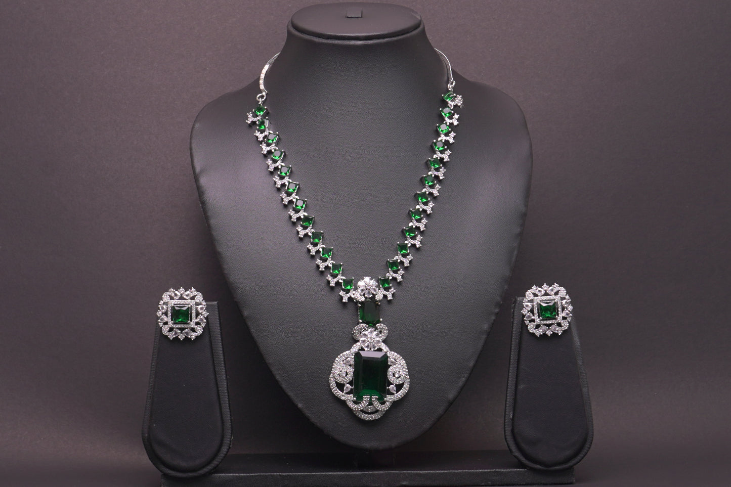 Statement necklace set in real American diamonds with a square cut emerald pendant