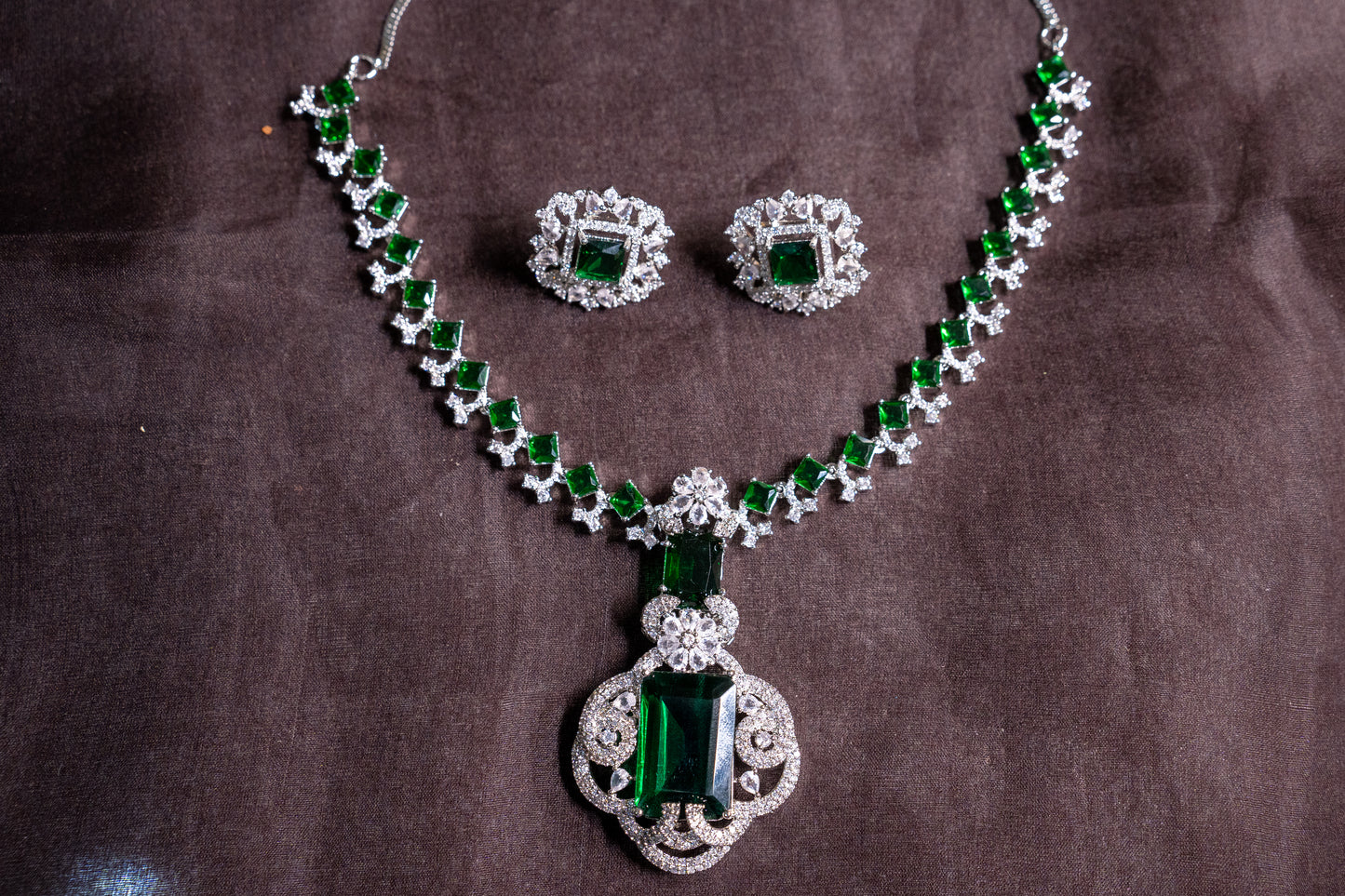 Statement necklace set in real American diamonds with a square cut emerald pendant