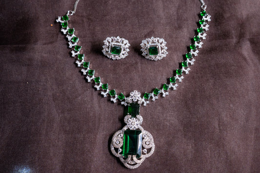 Statement necklace set in real American diamonds with a square cut emerald pendant