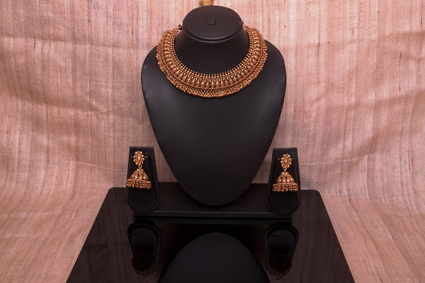 Unique traditional Indian necklace set with jhumkas in gold finish