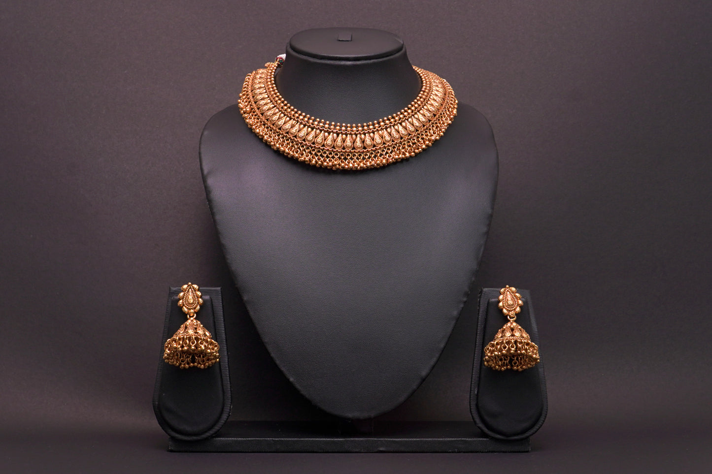 Unique traditional Indian necklace set with jhumkas in gold finish