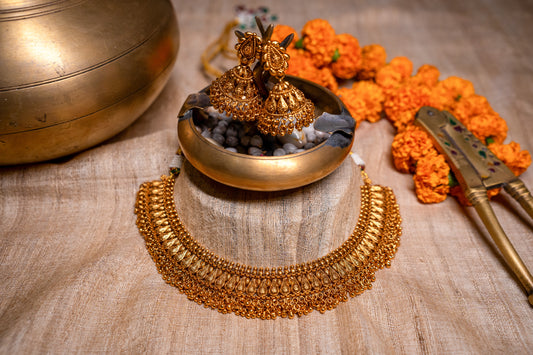 Unique traditional Indian necklace set with jhumkas in gold finish